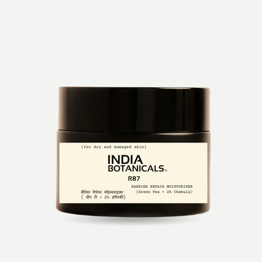 India Botanicals Barrier Repair Moisturiser in Black glass jar on neutral background.
